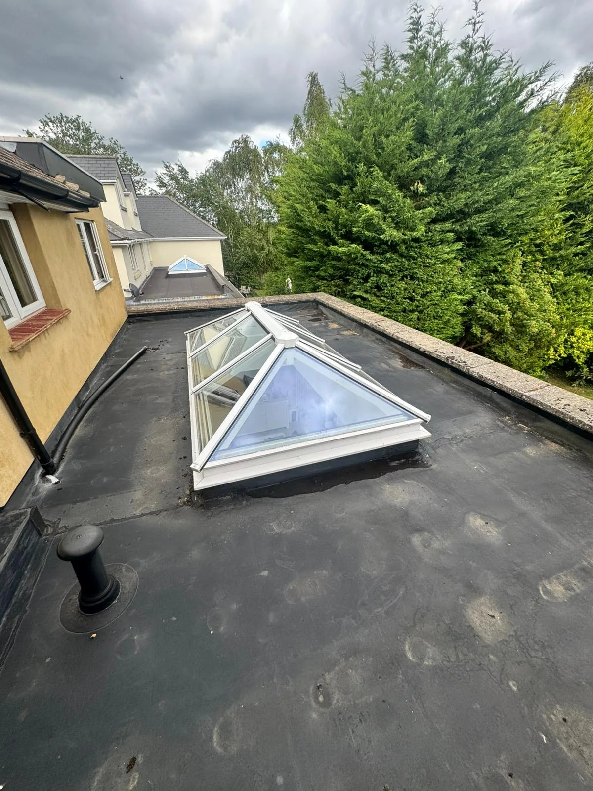 Existing flat roof and roof lantern in Cobham before replacement