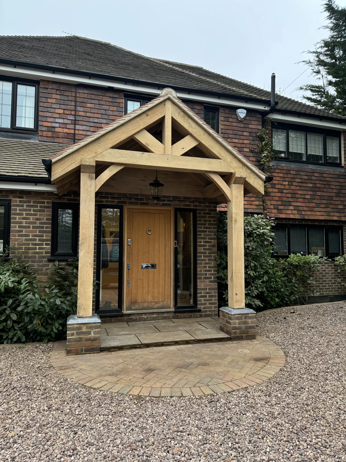 Bespoke oak porch with clay tiled roof in Fetcham
