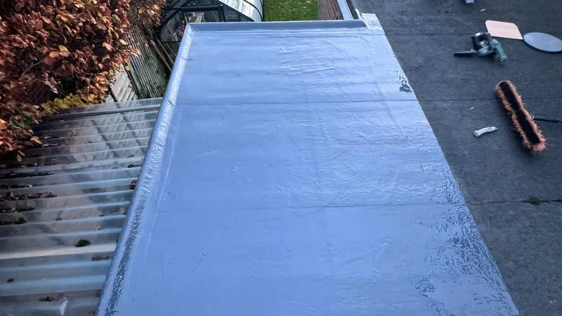 Completed waterproof coating on a small flat roof repair