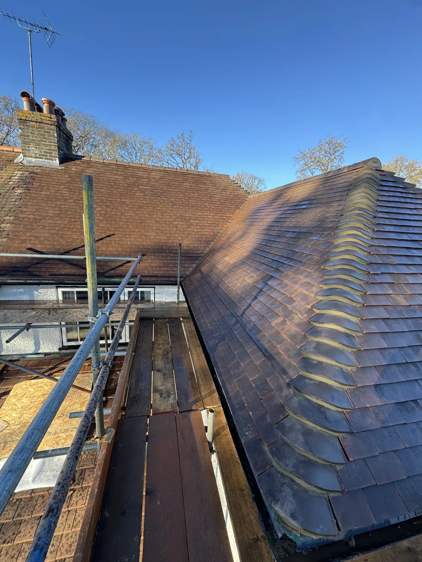 Pitched roof ridge and tile detail in Godalming