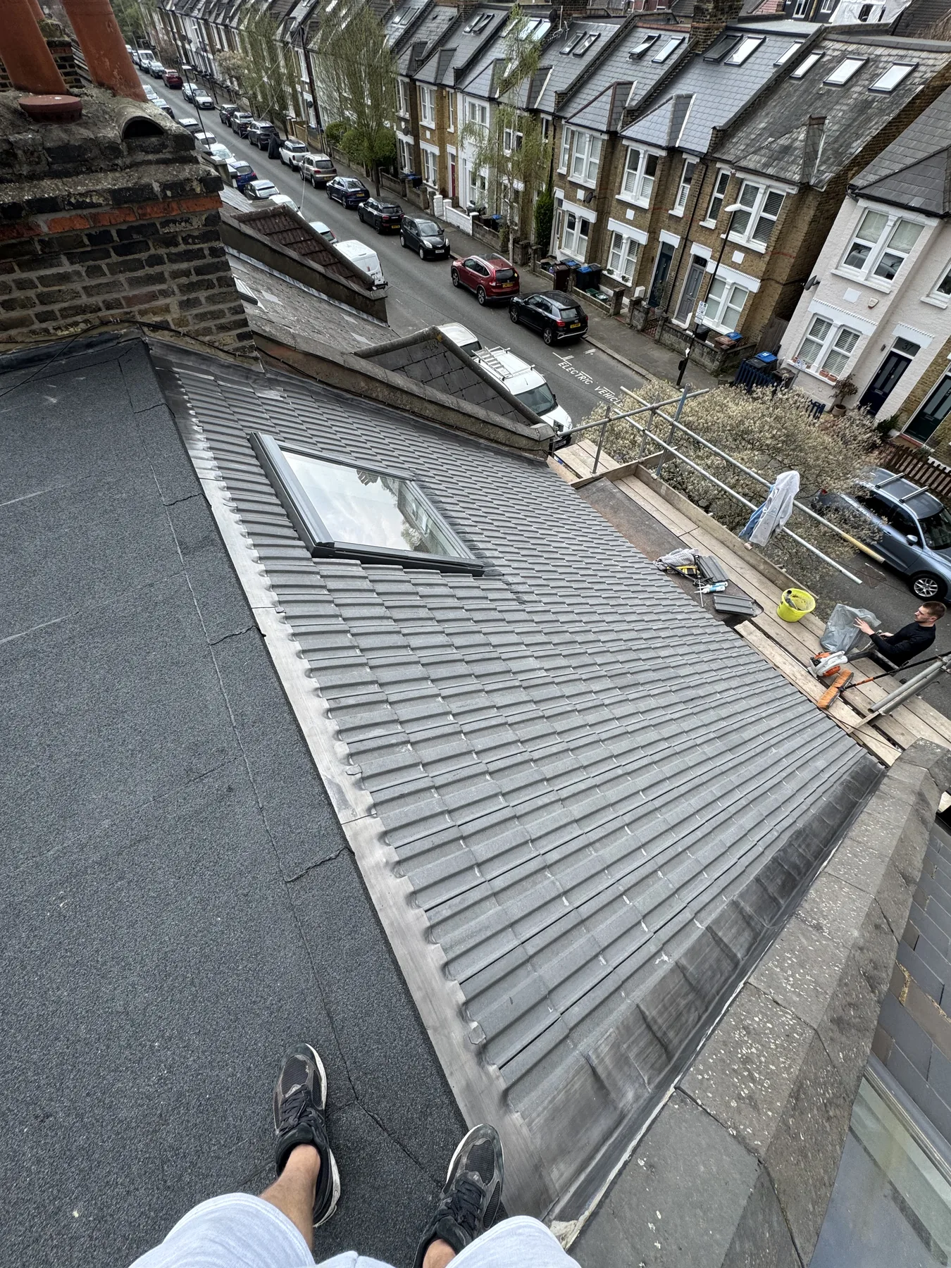 Raynes Park roof replacement with flat roof detailing and roof window