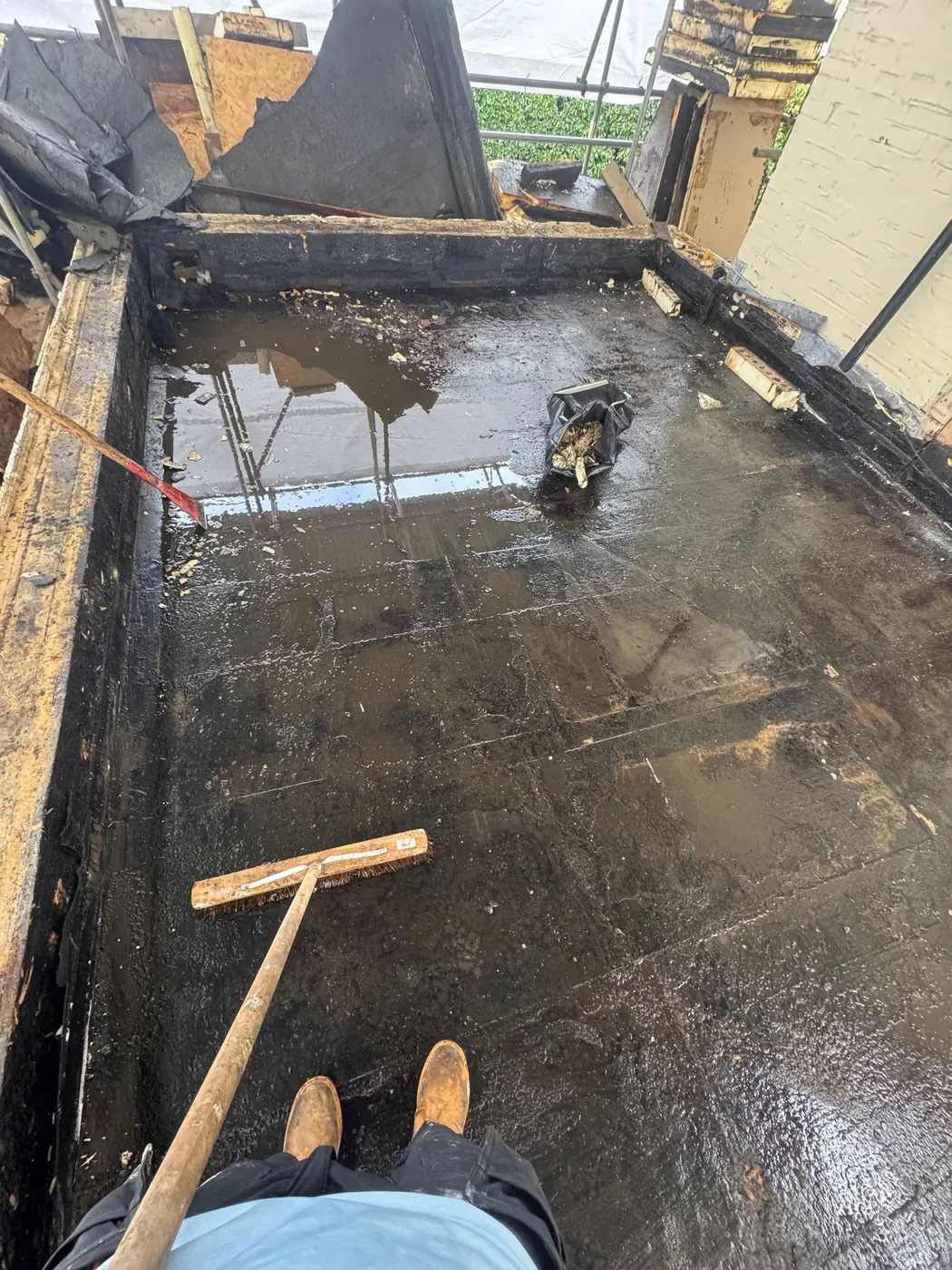 Existing flat roof covering before the ventilated cold-deck rebuild in Redhill
