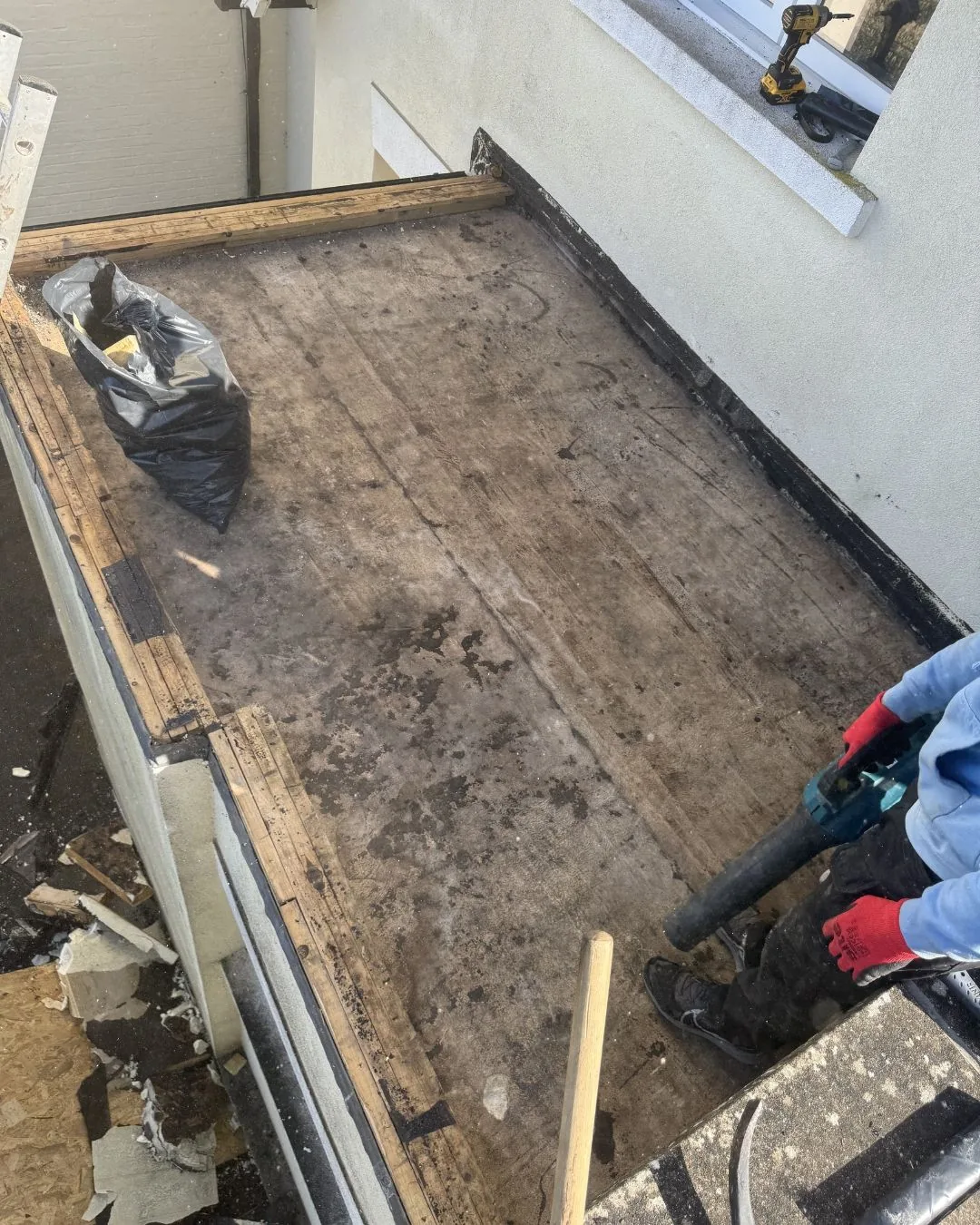 Smaller Redhill flat roof stripped during preparation for the warm-deck build-up