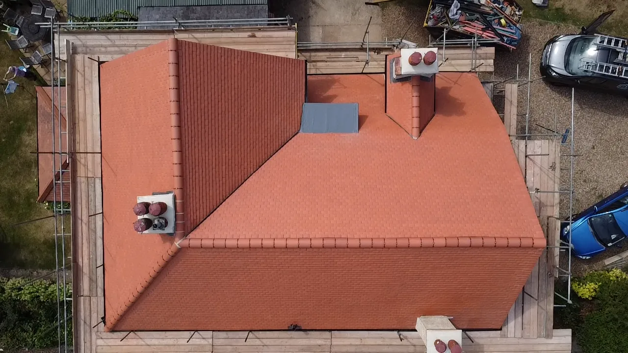 Clay tiled roof junctions and ridge detailing in Sunbury