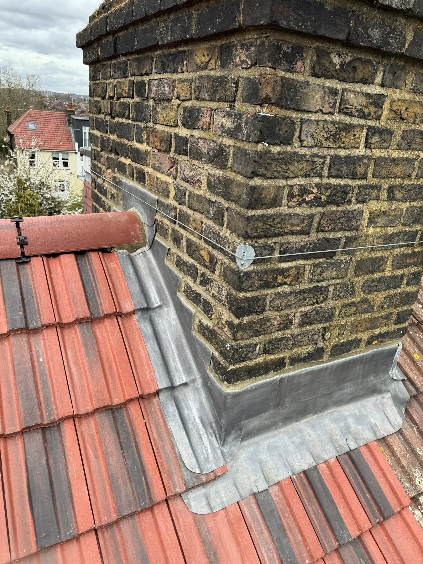 Bossed lead chimney flashings on a Wembley roof replacement